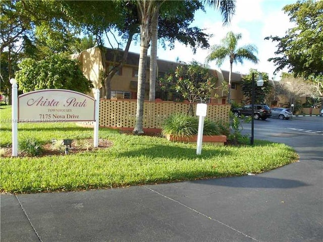 7175 Nova Dr Unit 204, Davie, FL 33317 - community sign with uncovered parking and a yard