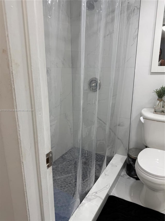 10661 SW 108th Ave Unit 2E, Miami, FL 33176 - bathroom featuring toilet and a marble finish shower