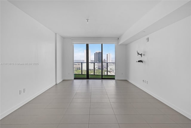 1600 NE 1st Ave Unit 1402, Miami, FL 33132 - unfurnished room featuring tile patterned floors, baseboards, and a view of skyline
