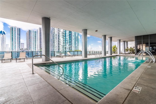 1600 NE 1st Ave Unit 1402, Miami, FL 33132 - indoor pool featuring a view of skyline and a patio
