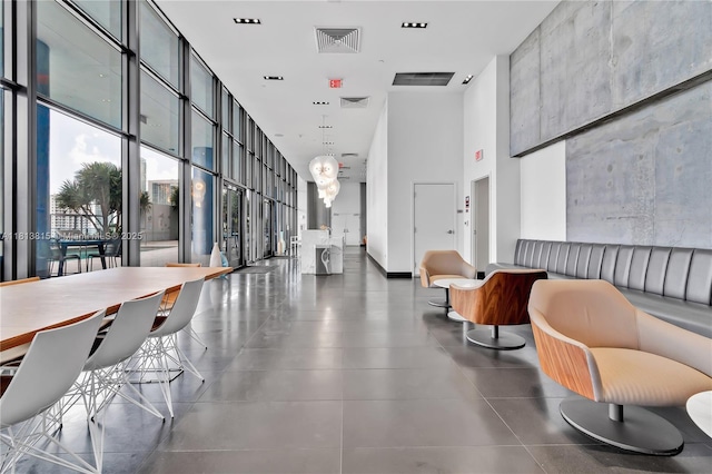 1600 NE 1st Ave Unit 1402, Miami, FL 33132 - building lobby featuring a high ceiling and a wall of windows