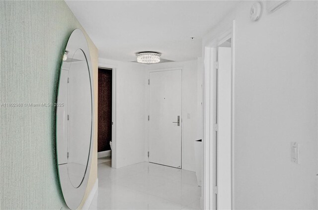 330 Sunny Isles Blvd Unit 5-1808, Sunny Isles Beach, FL 33160 - hallway featuring light tile patterned floors and baseboards