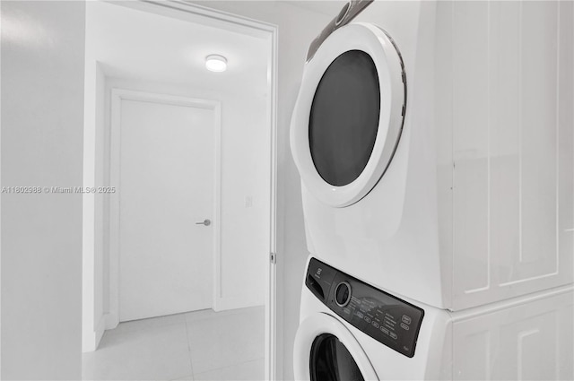 330 Sunny Isles Blvd Unit 5-1808, Sunny Isles Beach, FL 33160 - washroom with estacked washer and dryer and light tile patterned floors