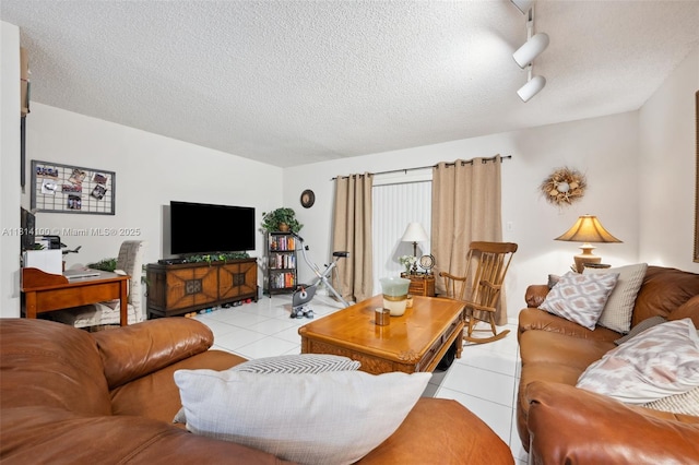 4119 NE 21st Ter, Lighthouse Point, FL 33064 - living area with light tile patterned floors, a textured ceiling, and track lighting