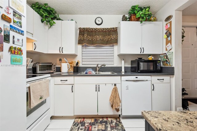 4119 NE 21st Ter, Lighthouse Point, FL 33064 - kitchen featuring white appliances, a sink, white cabinets, and a textured ceiling