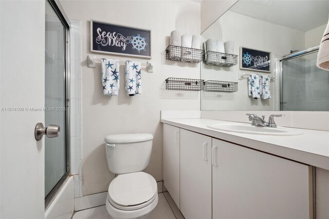 4119 NE 21st Ter, Lighthouse Point, FL 33064 - bathroom with vanity, toilet, and bath / shower combo with glass door