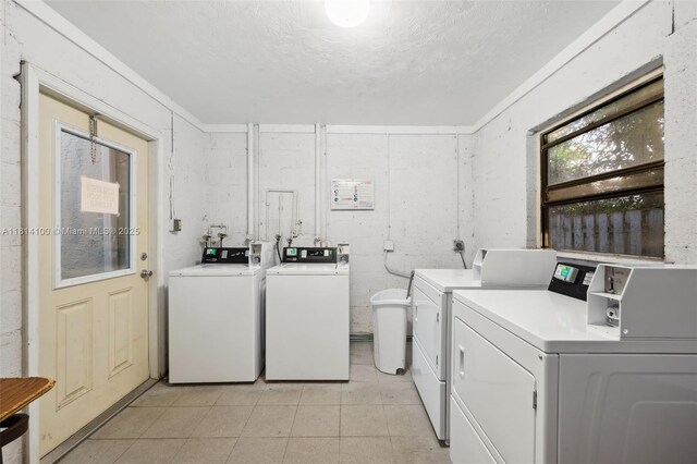 4119 NE 21st Ter, Lighthouse Point, FL 33064 - communal laundry room featuring washer and clothes dryer and light tile patterned floors