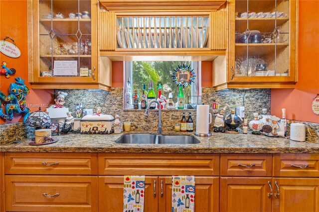 461 Morningside Dr, Miami Springs, FL 33166 - kitchen with a sink, glass insert cabinets, light stone counters, and tasteful backsplash