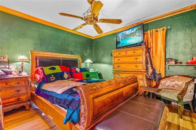 461 Morningside Dr, Miami Springs, FL 33166 - bedroom with crown molding, wood finished floors, a ceiling fan, and a textured wall