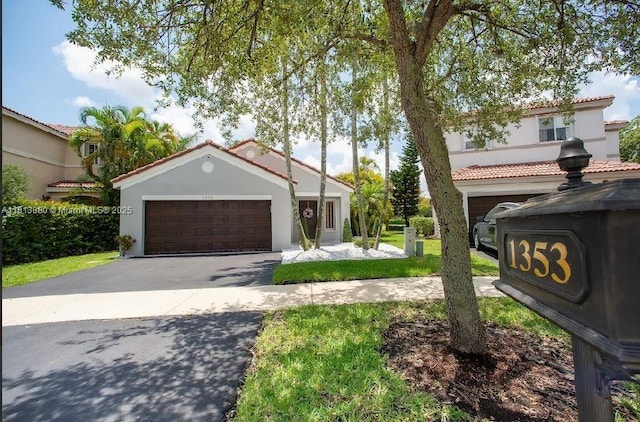 1353 Majesty Ter, Weston, FL 33327 - mediterranean / spanish-style house with stucco siding, a tiled roof, and a front yard
