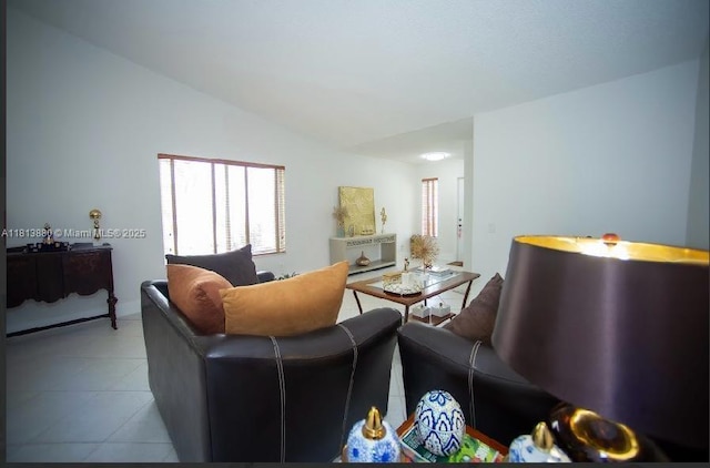 1353 Majesty Ter, Weston, FL 33327 - living area featuring vaulted ceiling and tile patterned flooring