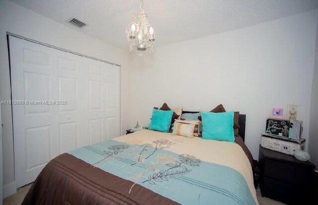 1353 Majesty Ter, Weston, FL 33327 - bedroom featuring a closet and a chandelier