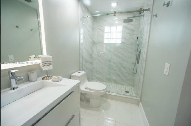 1353 Majesty Ter, Weston, FL 33327 - bathroom with a marble finish shower, vanity, and tile patterned flooring