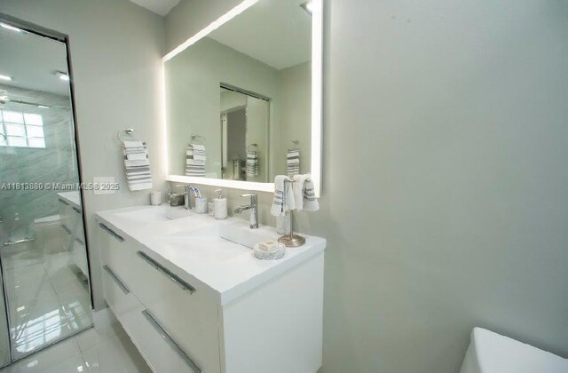 1353 Majesty Ter, Weston, FL 33327 - full bathroom featuring a marble finish shower, vanity, and tile patterned floors