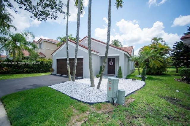 1353 Majesty Ter, Weston, FL 33327 - mediterranean / spanish home featuring a front yard, stucco siding, asphalt driveway, a tiled roof, and an attached garage
