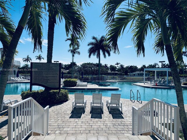 1353 Majesty Ter, Weston, FL 33327 - community pool with a patio area