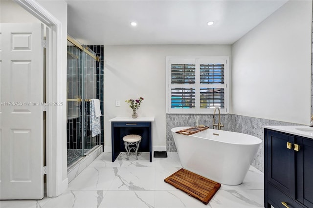16331 SW 23rd St, Miramar, FL 33027 - bathroom with marble look tile flooring, a freestanding bath, a shower stall, vanity, and recessed lighting