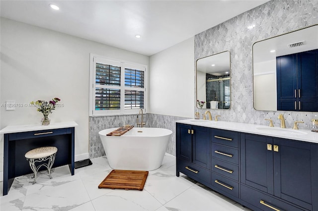 16331 SW 23rd St, Miramar, FL 33027 - full bathroom featuring tile walls, double vanity, a soaking tub, an enclosed shower, and a wainscoted wall
