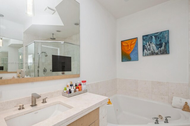 900 Brickell Key Blvd Unit 1702, Miami, FL 33131 - full bath with a shower stall, a whirlpool tub, and vanity