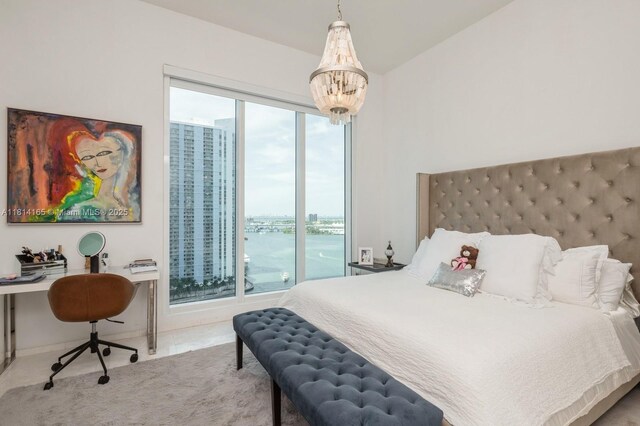 900 Brickell Key Blvd Unit 1702, Miami, FL 33131 - bedroom with a desk, a chandelier, and a water view