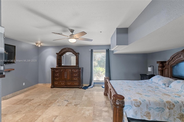 200 Asphodel Dr, Al, ,, AL 36303 - bedroom featuring a ceiling fan, light stone finish floors, and a textured ceiling