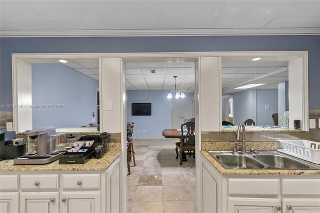 200 Asphodel Dr, Al, ,, AL 36303 - kitchen featuring a drop ceiling, a chandelier, light countertops, and white cabinetry