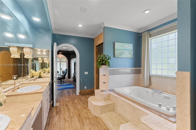 200 Asphodel Dr, Al, ,, AL 36303 - bathroom featuring vanity, a tub with jets, healthy amount of natural light, wood finished floors, and ornamental molding