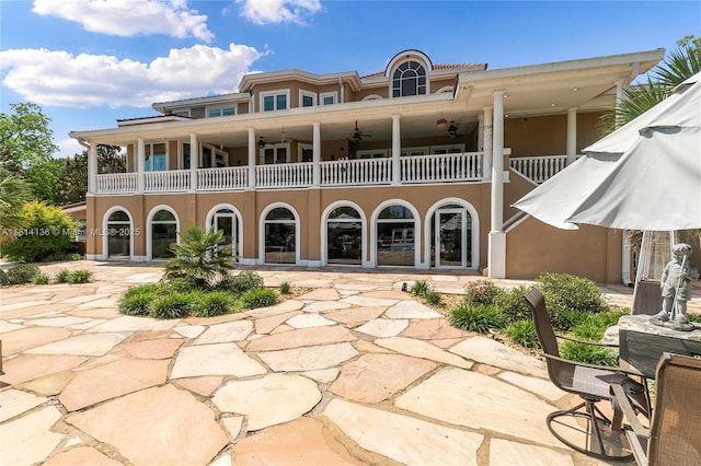 200 Asphodel Dr, Al, ,, AL 36303 - rear view of house with a balcony, a patio, and stucco siding