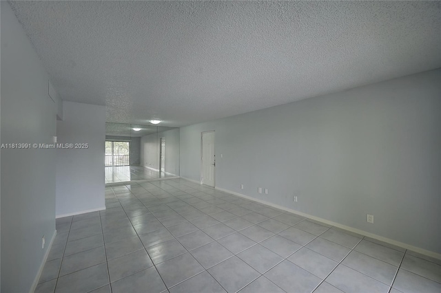 9965 Pineapple Tree Dr Unit 203, Boynton Beach, FL 33436 - unfurnished room featuring a textured ceiling and tile patterned flooring