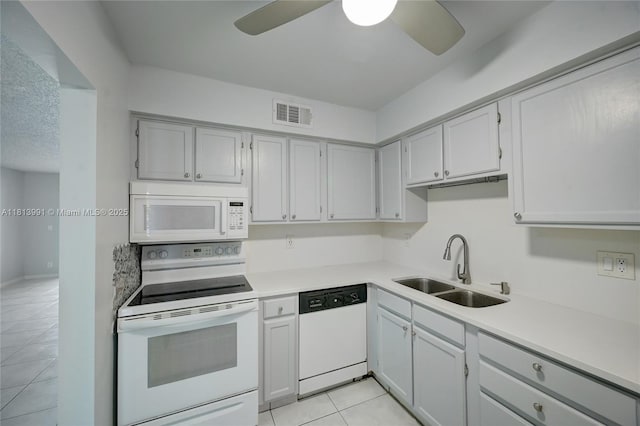 9965 Pineapple Tree Dr Unit 203, Boynton Beach, FL 33436 - kitchen featuring white appliances, light tile patterned flooring, a ceiling fan, and light countertops