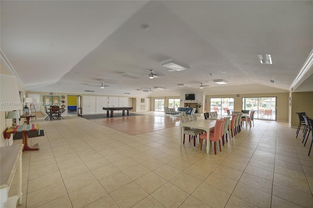 9965 Pineapple Tree Dr Unit 203, Boynton Beach, FL 33436 - dining space with light tile patterned floors, vaulted ceiling, and a ceiling fan