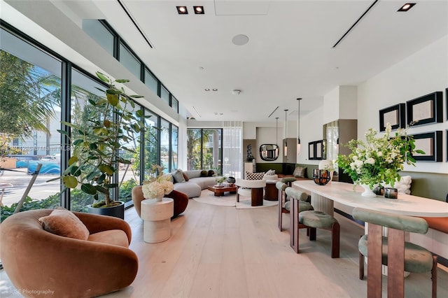 9901 W Bay Harbor Dr Unit 601, Bay Harbor Islands, FL 33154 - living area featuring plenty of natural light and light wood finished floors
