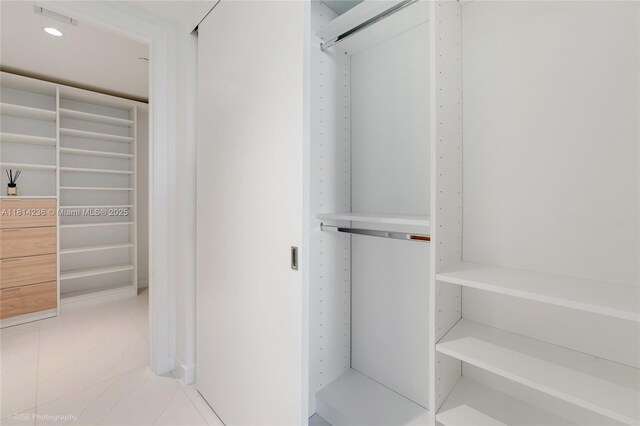 9901 W Bay Harbor Dr Unit 601, Bay Harbor Islands, FL 33154 - spacious closet featuring light marble finish flooring