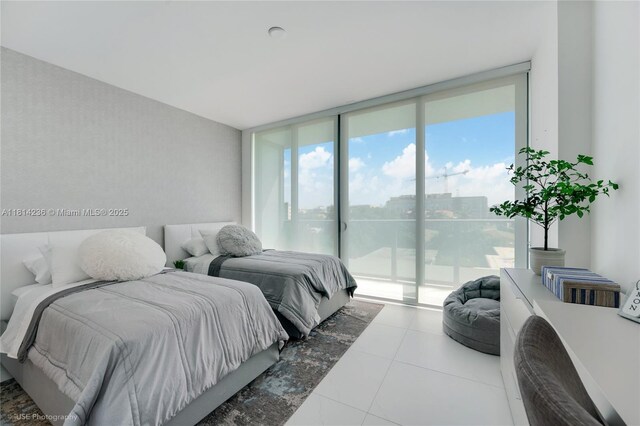 9901 W Bay Harbor Dr Unit 601, Bay Harbor Islands, FL 33154 - tiled bedroom with access to exterior and expansive windows