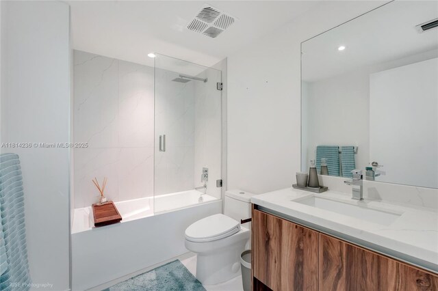 9901 W Bay Harbor Dr Unit 601, Bay Harbor Islands, FL 33154 - bathroom with vanity, toilet, bathtub / shower combination, and recessed lighting