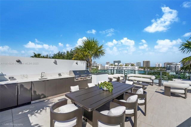 9901 W Bay Harbor Dr Unit 601, Bay Harbor Islands, FL 33154 - view of patio featuring a sink, a city view, and outdoor dining area