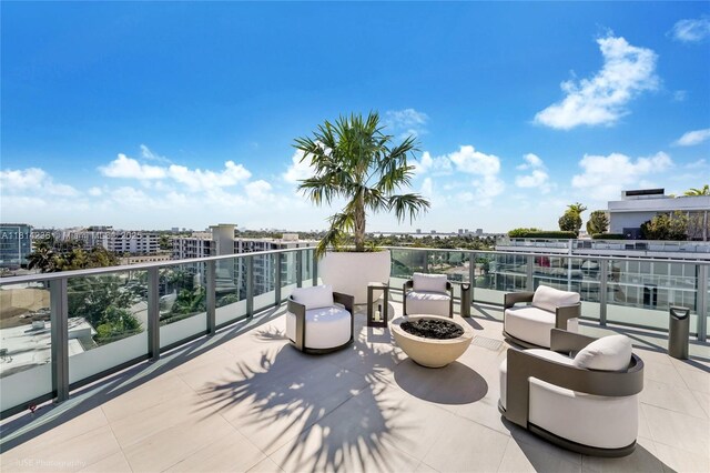 9901 W Bay Harbor Dr Unit 601, Bay Harbor Islands, FL 33154 - view of patio with a balcony and a city view