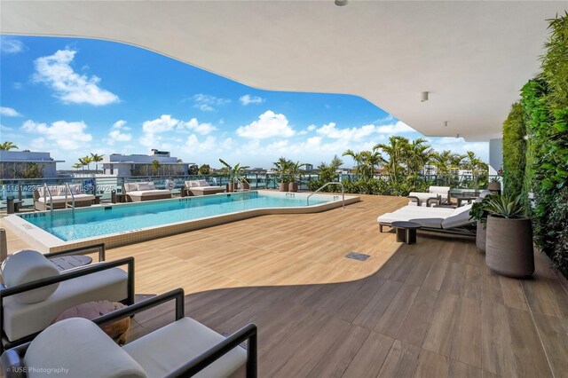 9901 W Bay Harbor Dr Unit 601, Bay Harbor Islands, FL 33154 - community pool with outdoor lounge area and a deck