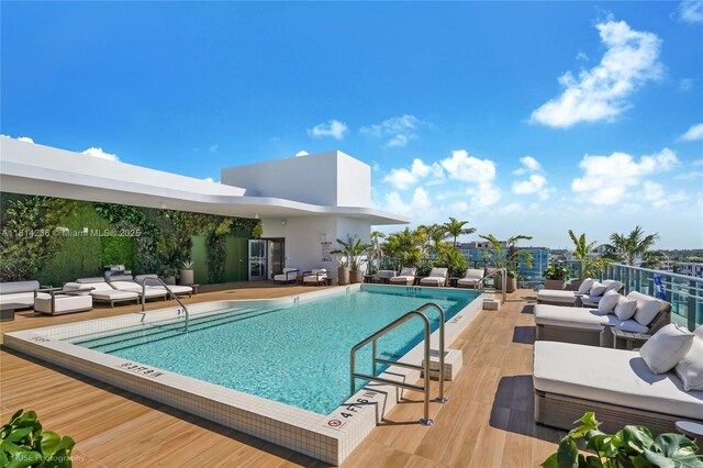 9901 W Bay Harbor Dr Unit 601, Bay Harbor Islands, FL 33154 - community pool featuring an outdoor living space and a deck