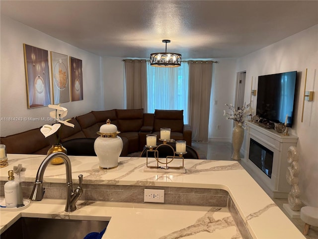 7100 NW 17th St Unit 404, Plantation, FL 33313 - living room featuring a glass covered fireplace