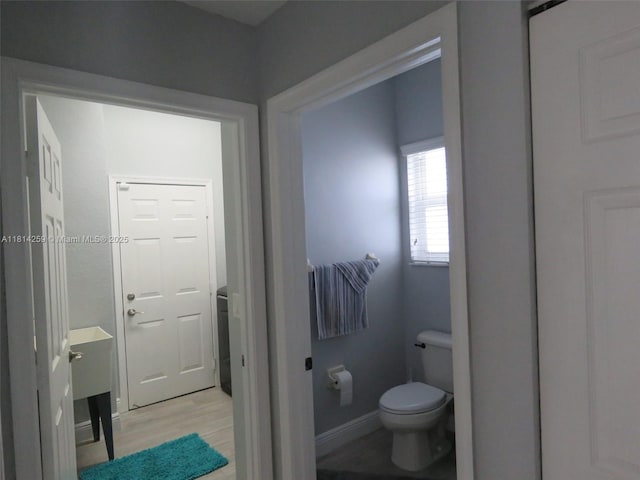 16815 SW 49th Ct, Miramar, FL 33027 - bathroom with toilet, wood finished floors, and baseboards