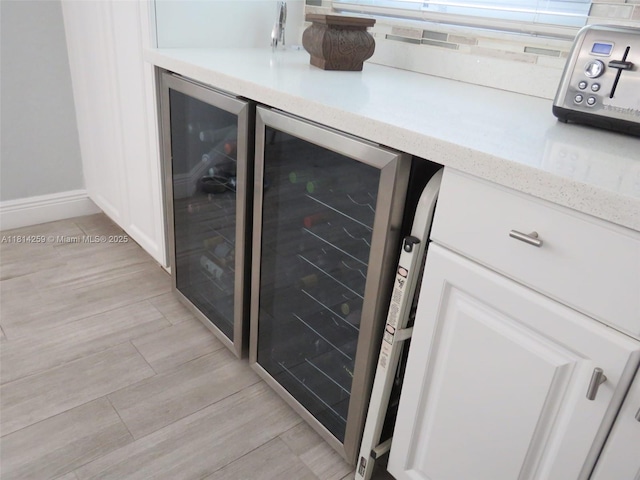 16815 SW 49th Ct, Miramar, FL 33027 - indoor dry bar featuring wine cooler, light wood-style flooring, and baseboards