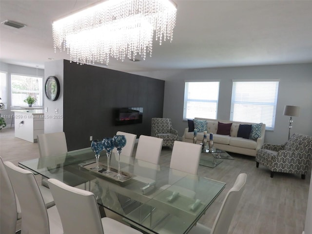 16815 SW 49th Ct, Miramar, FL 33027 - dining area with light wood finished floors and a chandelier