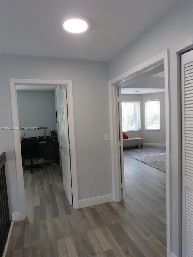 16815 SW 49th Ct, Miramar, FL 33027 - hallway with wood finished floors, an office area, and baseboards