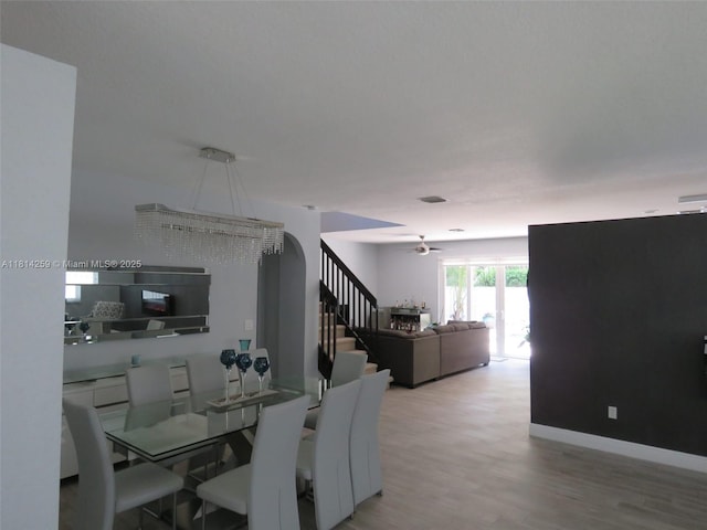 16815 SW 49th Ct, Miramar, FL 33027 - dining area featuring light wood-style floors, ceiling fan, and arched walkways