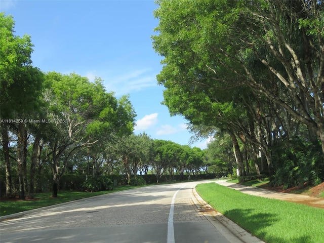 16815 SW 49th Ct, Miramar, FL 33027 - view of asphalt road with curbs and sidewalks