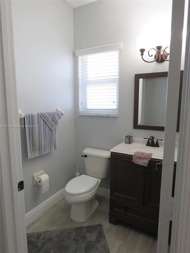 16815 SW 49th Ct, Miramar, FL 33027 - bathroom featuring vanity, toilet, a chandelier, and baseboards
