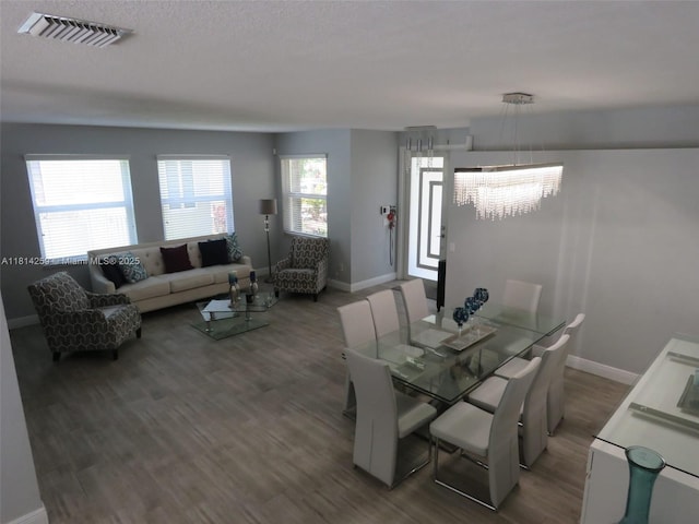 16815 SW 49th Ct, Miramar, FL 33027 - dining area featuring a chandelier, baseboards, and wood finished floors