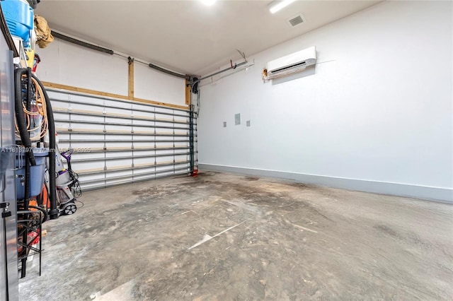 1437 SE 13th St, Deerfield Beach, FL 33441 - garage featuring an AC wall unit and baseboards