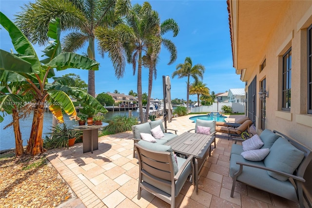1437 SE 13th St, Deerfield Beach, FL 33441 - view of patio with outdoor lounge area and a water view